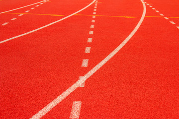 Fototapeta premium Red running track Synthetic rubber on the athletic stadium.