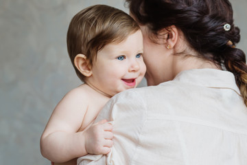 Little baby in the arms of my mother