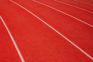 Fototapeta premium Red running track Synthetic rubber on the athletic stadium.