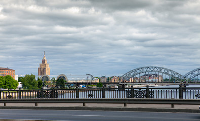 View on Railway Bridge over Daugava River and the building of the Academy of Sciences in Riga, Latvia