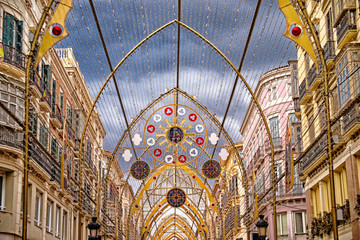 Christmas street decorations in Malaga, Andalucia, Spain. New Year and Christmas lights decorations on the main pedestrian street in the city centre of Malaga.