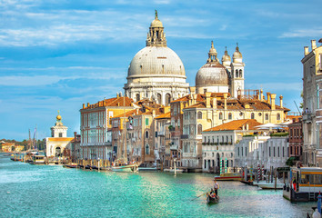 Fototapeta na wymiar Italy beauty, cathedral Santa Maria della Salute and gondola on Grand canal in Venice , Venezia
