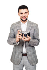 collector of old film cameras. stylish young bearded guy with a camera in his hand