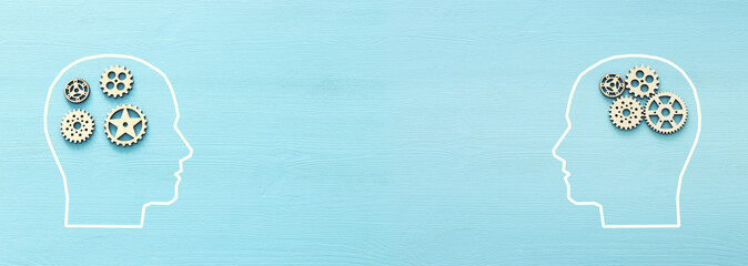 Brain disorder against order made from wooden cogwheels into human head. Concept of alzheimer's disease, memory loss, obsessive compulsive, adhd, anxiety disorders and mental health topic.