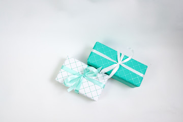 Green and white gift boxes with ribbons isolated on white background, holidays