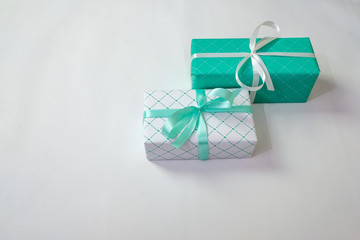 Fototapeta na wymiar Green and white gift boxes with ribbons isolated on white background, holidays