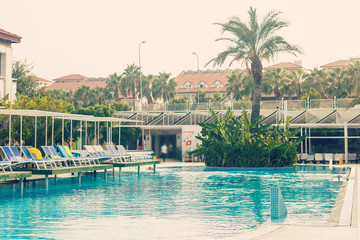 Fototapeta na wymiar Resort swimming pool with empty plank board
