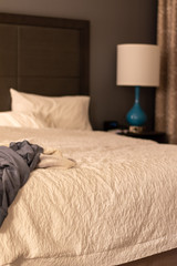 Clothes thrown on a bed