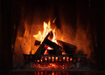 Fire flaming inside a fireplace