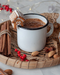 cup of coffee with cinnamon and cookies