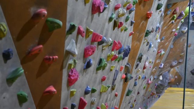 Empty indoor climbing wall in a bouldering climbing center