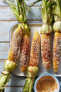 Grilled Corn On Blue Wood Surface