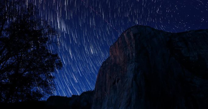 Yosemite El Capitan Star Trails at Night. a timelapse of stars rotating and creating trails around El Capitan Mountain in Yosemite Park