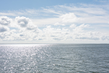 Panorama of sunny sky and sea waves 
