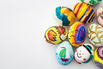 Detail of painted Easter eggs with different forms, cartoons and bright colors on isolated white background