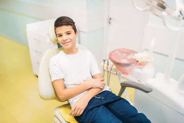 Boy in a dental chair, pediatric dentistry