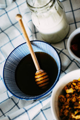 Healthy eating. Honey in blue china bowl.