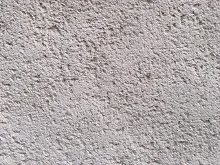 Rough bumpy white concrete texture background.