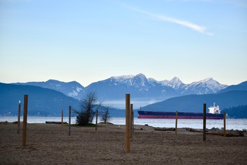 beach with snow capped mountains