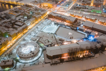 Aeria drone view of historical city part with old architecture and modern park between two artificial river channel, round building in the center, new Holland, Saint Petersburg, Russia