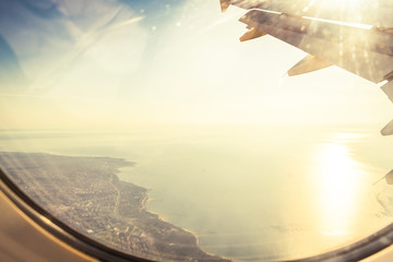 Landscape photo of the sea coast from an airplane.