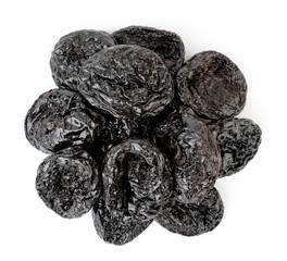 Heapof prunes on a white. The form of the top.