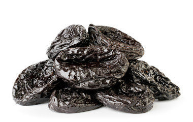 Heap sweet dried plums closeup on a white. Isolated