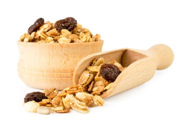 Muesli in wooden plate and spoon on a white, isolated.