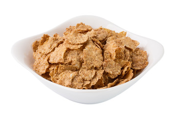 Corn flakes in white plate on a white background isolated