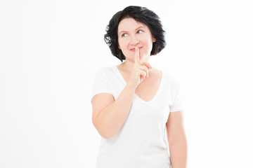 Middle age woman showing shh sign isolated on white background. Summer blank template t shirt. Mock up and copy space. Menopause