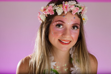 Carnaval Brazil. Face of brazilian blonde woman wearing carnival costume. Bright background. Party concept, celebration and festival.