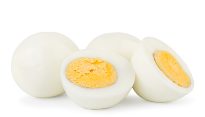 Boiled eggs and two halves close-up on a white. Isolated