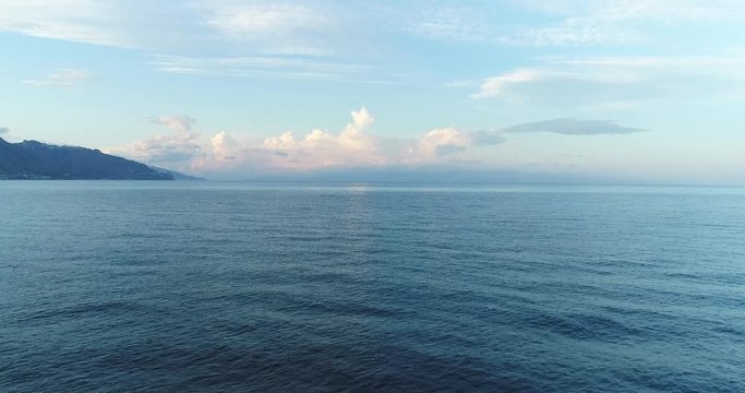 Aerial, Sicily coast with beautiful calm sea in the evening sky 4K 50fps