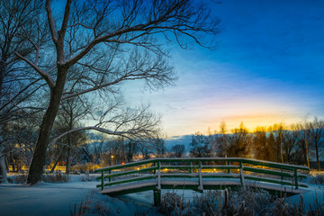 Sun sets over Park in Elk  covered with snow.