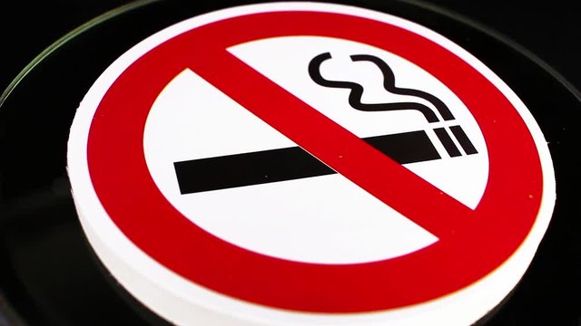 Don t smoke smoking sign symbol on rotating plate seamless looping background