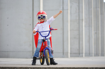 A funny, little superhero. Concept boy imagination. Happy childhood.