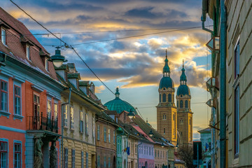 A beautiful street and Holy Trinity Cathedral at sunset in Sibiu, Romania