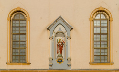 Virgin Mary statue on a Catholic Church facade  in Sibiu, Romania