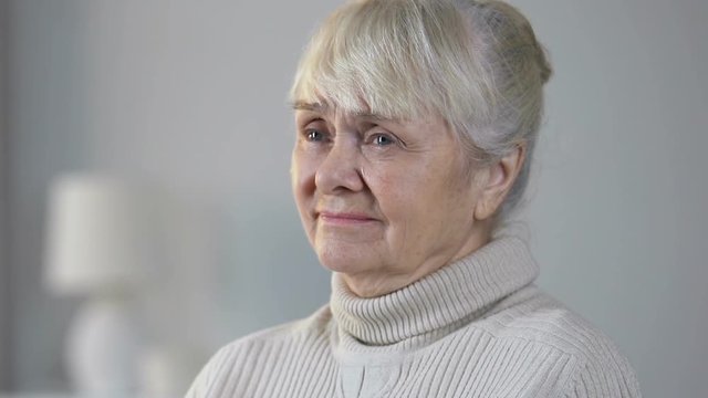 Incurably sick retiree female crying and thinking about life, feeling helpless