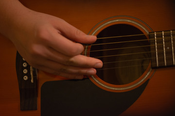 Fingering a guitar