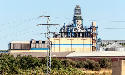 Fototapeta na wymiar Power plant located in the fields of La Rioja in Spain on a sunny day.