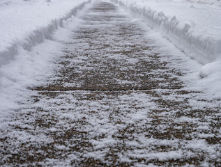 Sidewalk Covered in Snow During Storm