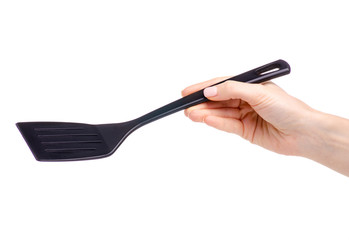 Kitchen spatula in hand on a white background. Isolation