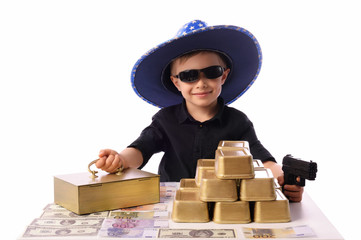A little boy, 5 years old, plays with gold bars. He works in the bank as a security guard. The...