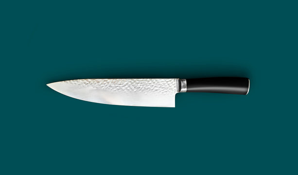 Chef's knife for your kitchen isolated on green