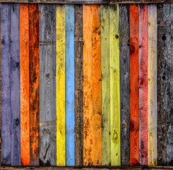 Multicolored wooden background with a wide range of saturated colors.