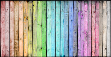 Multicolored wooden background with a wide range of saturated colors.