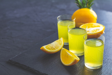 Lemon alcohol drink liqueur limoncello with pieces of lemon