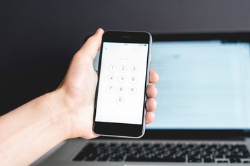 person enter security code on his device b