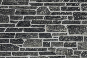 Ancient stone wall texture with irregular shapes